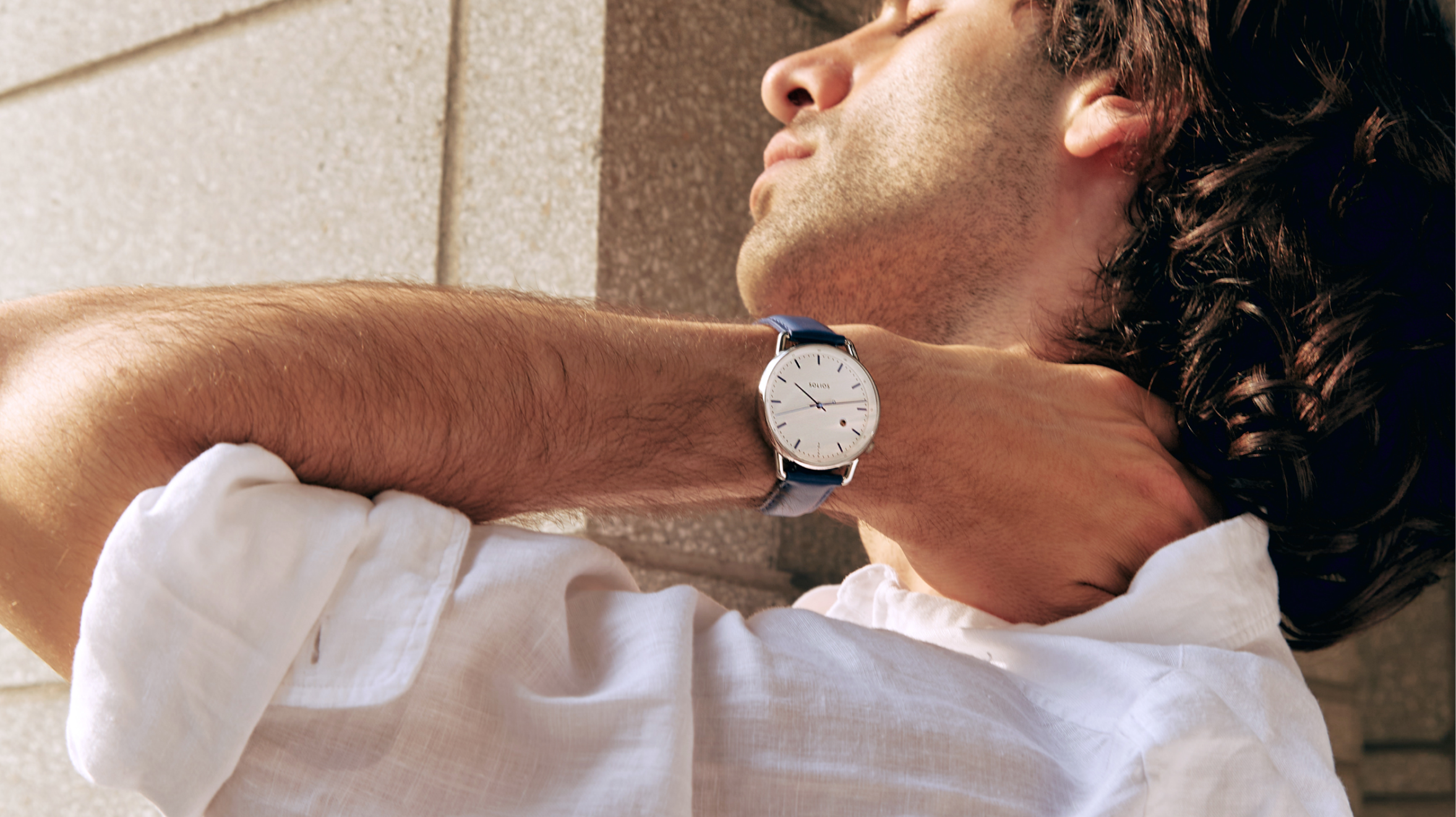 Solar powered watch on men's wrist
